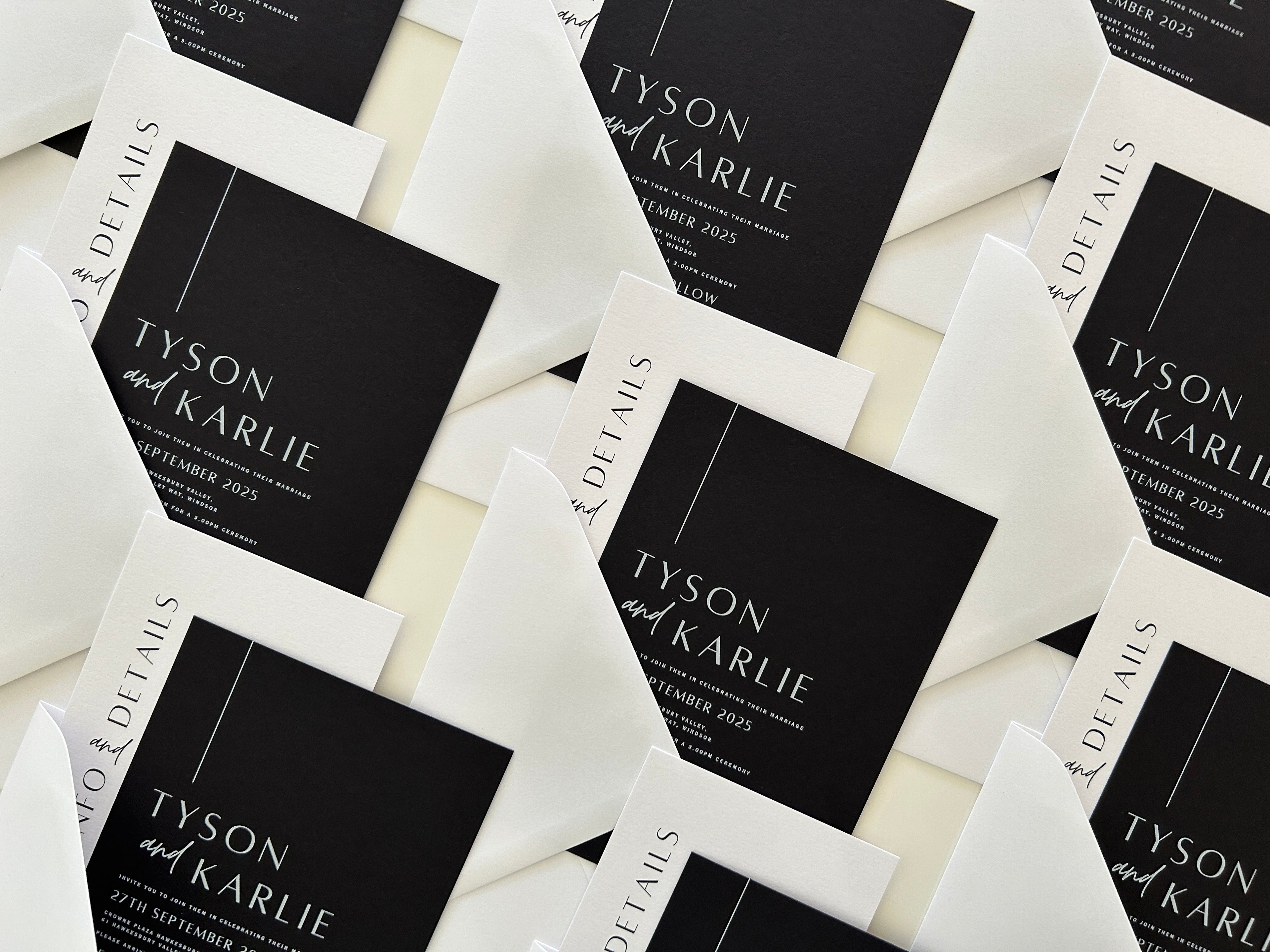 Black and white wedding invitation cards with 'Tyson and Karlie' text on a light background
